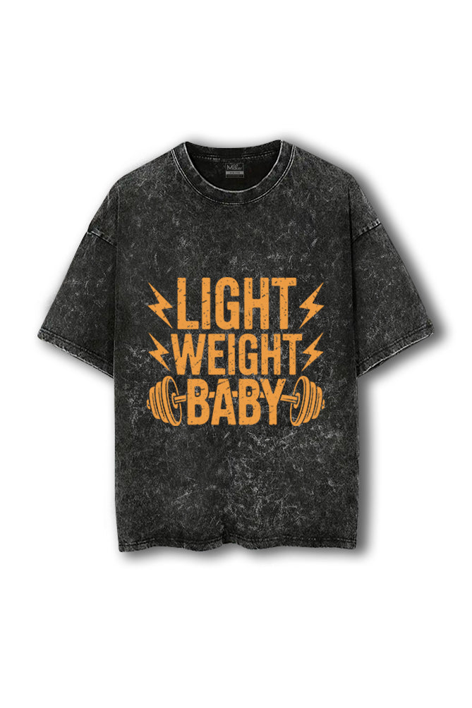 Black t-shirt with 'Light Weight Baby' text and graphic on a white background