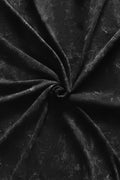 Close-up of Manmaker black acid wash fabric with folds