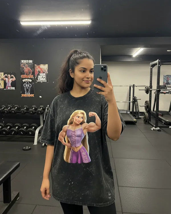 Person wearing Manmaker t-shirt with a graphic of a character in a gym setting